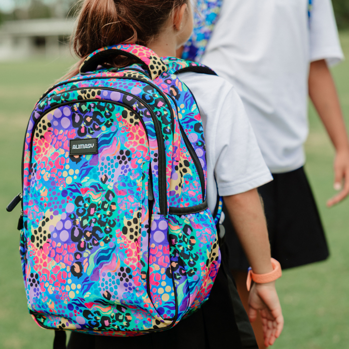 Electric Leopard Midsize Kids Backpack lifestyle image child wearing, lightweight waterproof school bag for boys and girls