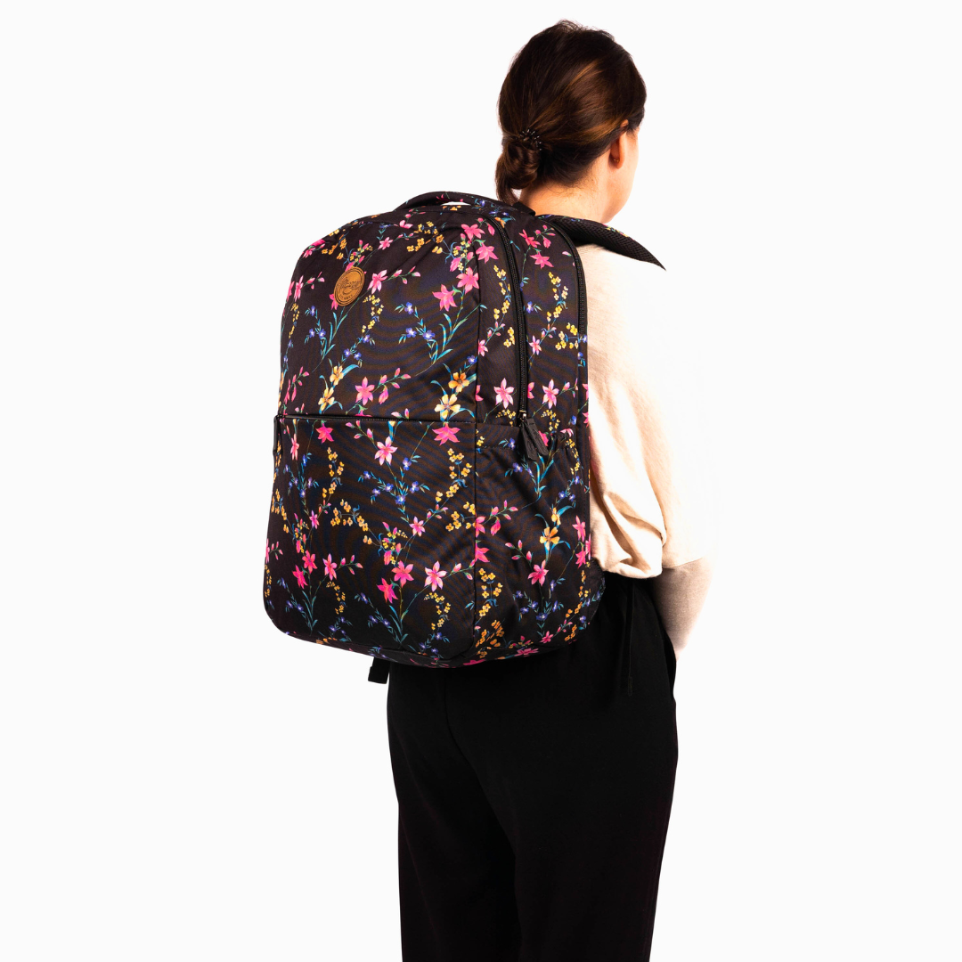side view of female wearing alimasy ladies black floral laptop backpack 
