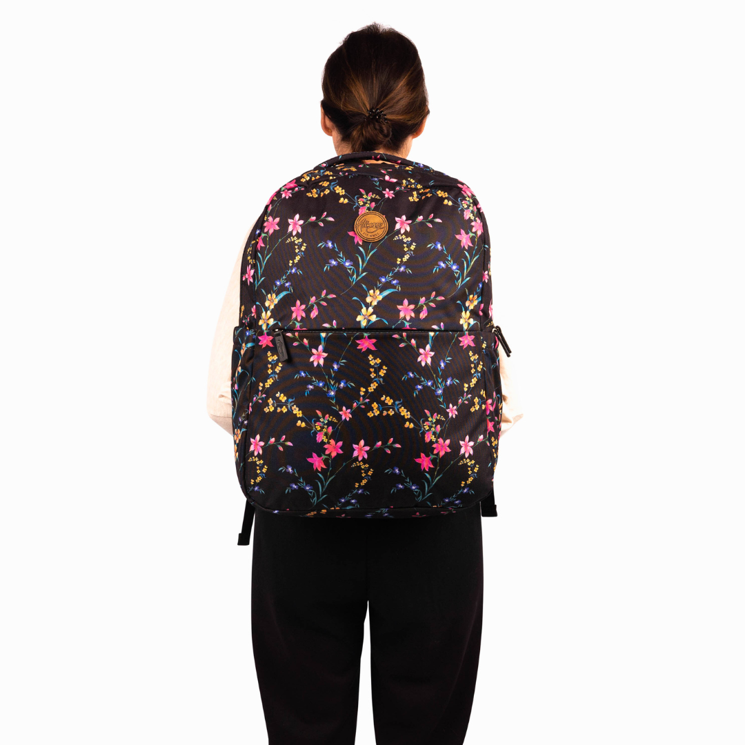 female model wearing alimasy black floral large laptop backpack for work front view