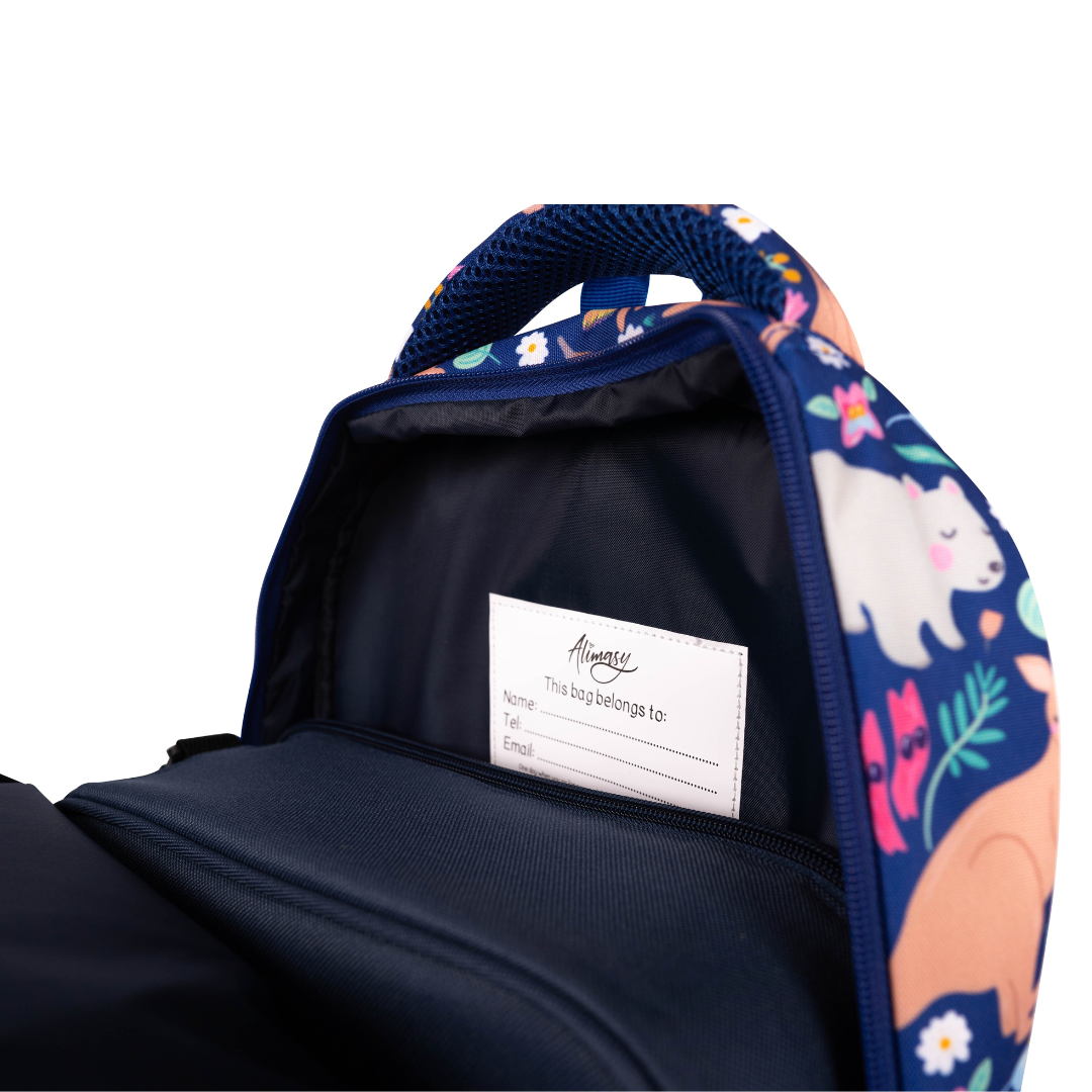 inside of alimasy blue kids backpack with australian animals pattern with lunchbox and name label