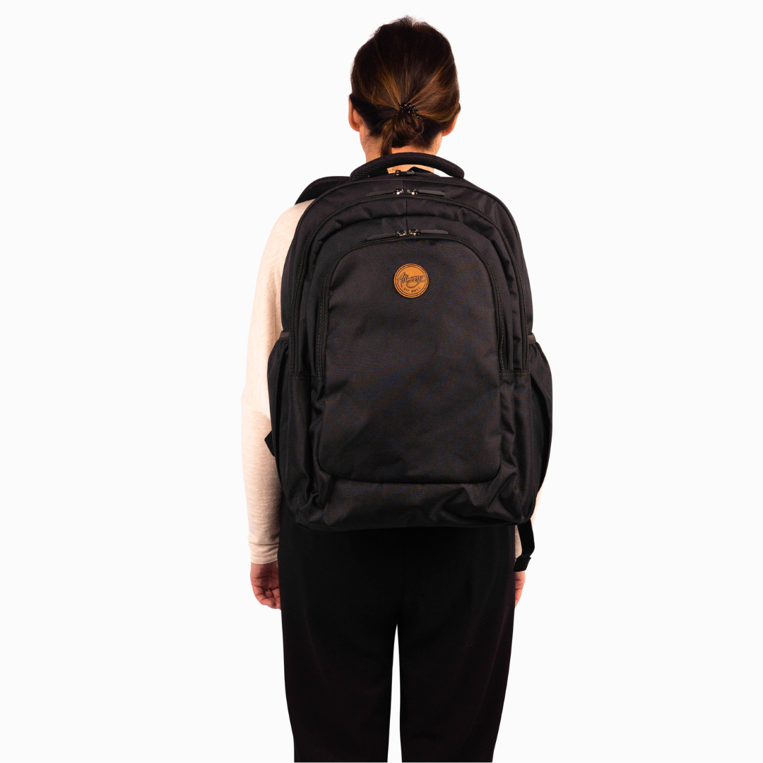 front view of female model wearing alimasy large black school backpack