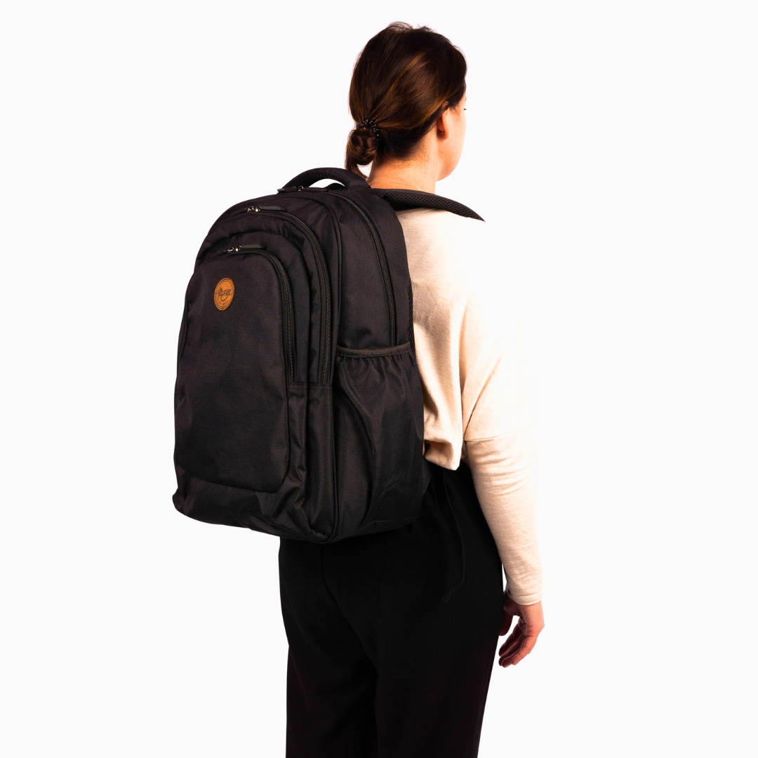 women model wearing alimasy large black backpack for school bag side angle
