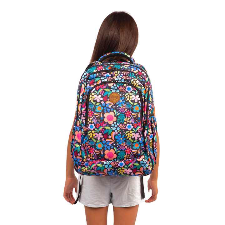 girl wearing alimasy black floral kasey rainbow wonderland print kids backpack australia
